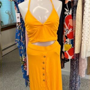 Gold tree so piece with cropped top and long skirt